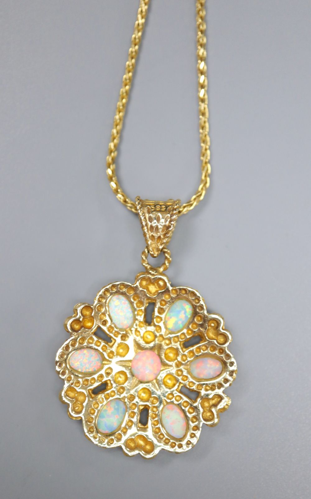 A Turkish 585 and white opal flowerhead pendant on chain by Istor, 13.4g